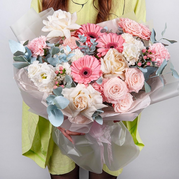 Gerbera pink - 3, Peony style roses - 3, Baltica White Spray Chrysanthemum - 1, lisianthus - 2, Pink carnation - 7, Peony sprayrose - 3, Hypericum, Eucalyptus, Wrapping Paper